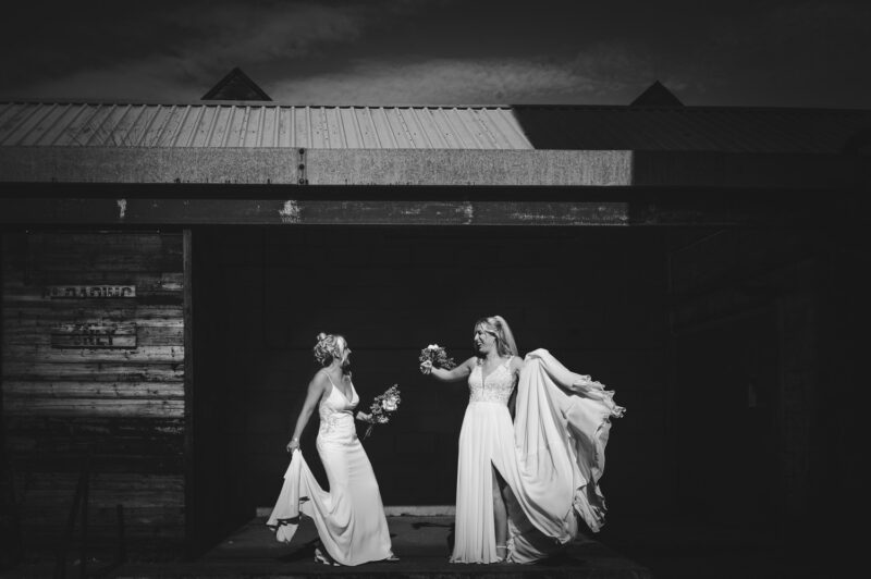 Two Brides, One Incredible Day – The Venue Bowers Mill Wedding Photography 38 Two brides holding dress and dancing The Venue Bowers Mill Halifax