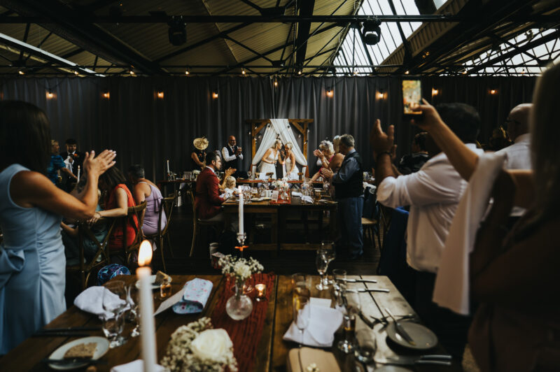 Two Brides, One Incredible Day – The Venue Bowers Mill Wedding Photography 65 Guests laughing during speeches The Venue Bowers Mill wedding photography