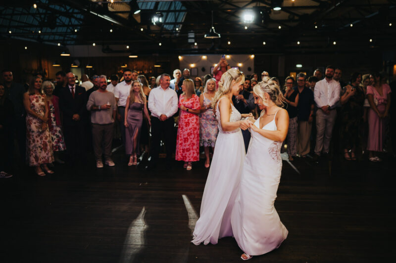 Two Brides, One Incredible Day – The Venue Bowers Mill Wedding Photography 74 Emotional hug during first dance The Venue Bowers Mill Halifax wedding photographer